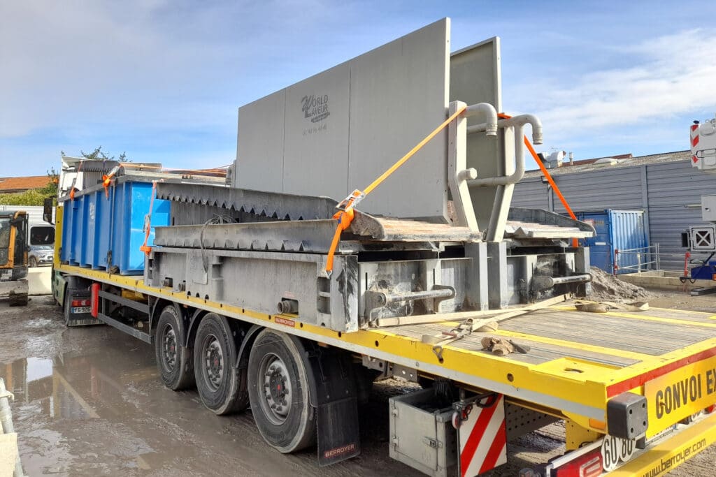 A truck transporting a World Laveur wheel washer